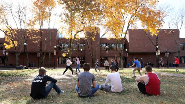 Students playing Frisbee in Fountain Square